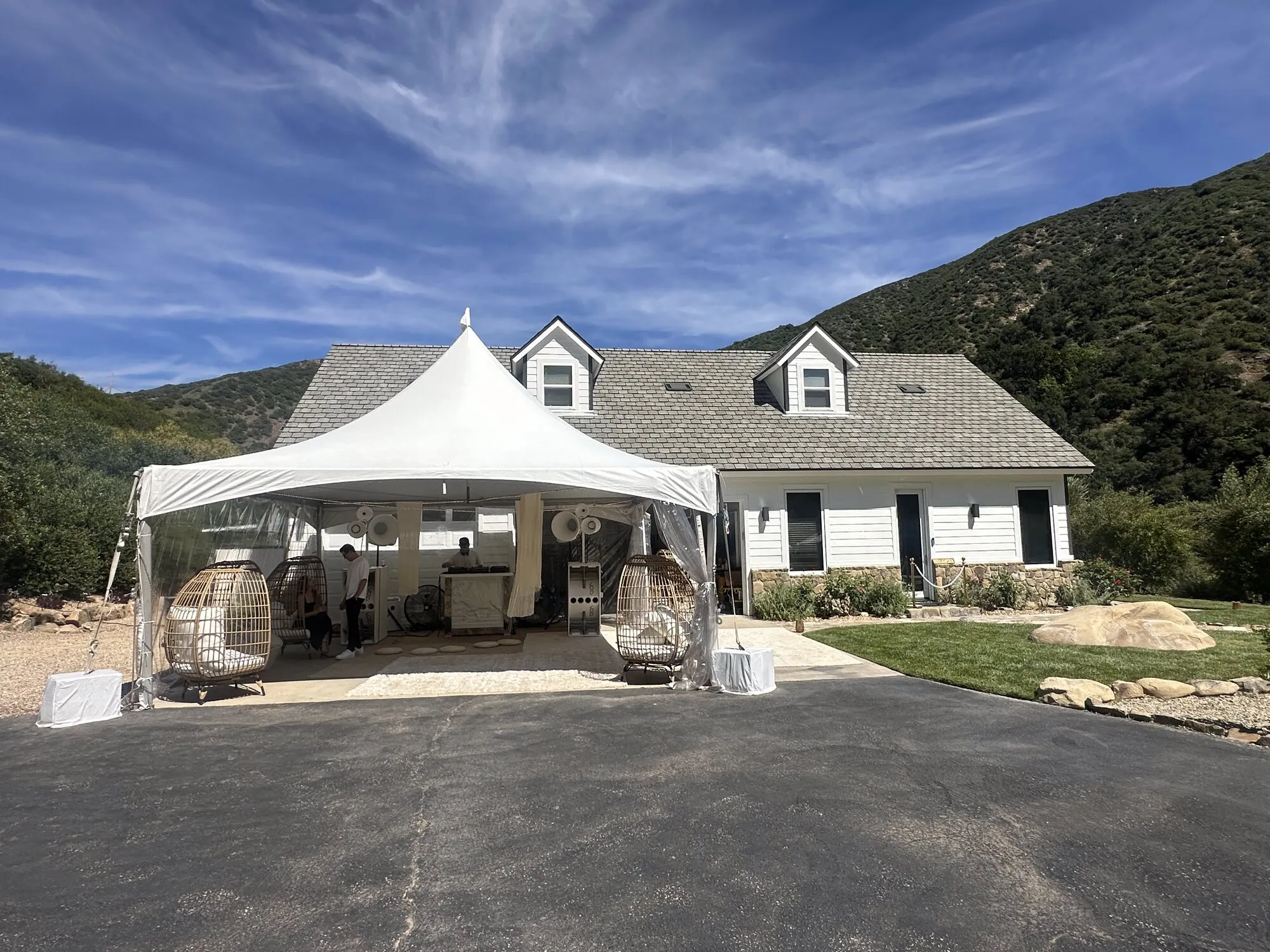 White event tent at a private party in Ojai with mountains behind