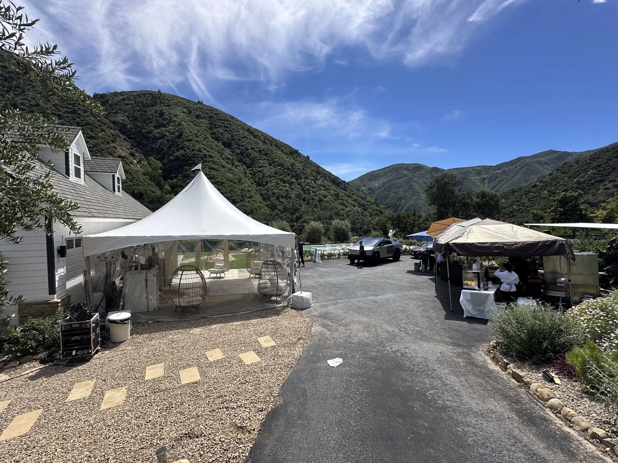 Tent and driveway setup with mountain views