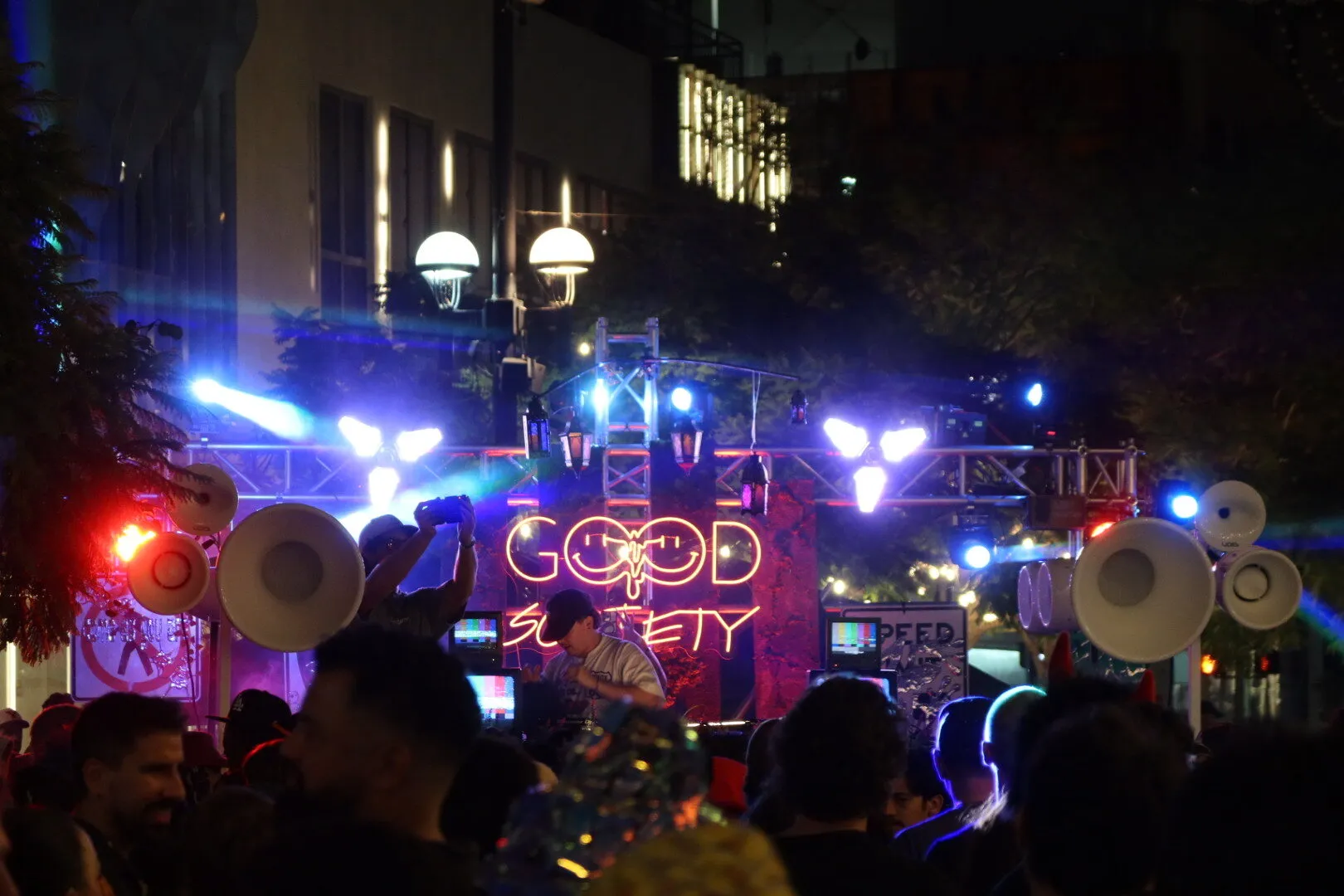 White Void Air Motion horns on both sides of the neon Good Society stage